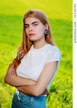 beautiful woman with wooden tunnels in her ears beautiful woman with wooden tunnels in her ears 32126791