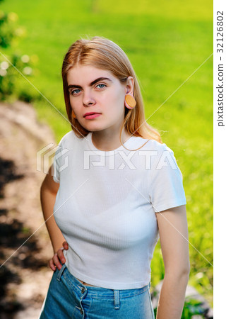 beautiful woman with wooden tunnels in her ears beautiful woman with wooden tunnels in her ears 32126802