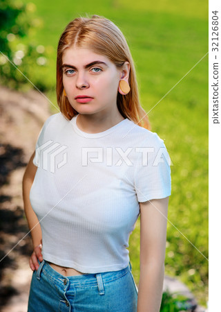 beautiful woman with wooden tunnels in her ears beautiful woman with wooden tunnels in her ears 32126804