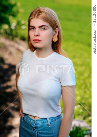 beautiful woman with wooden tunnels in her ears beautiful woman with wooden tunnels in her ears 32126806
