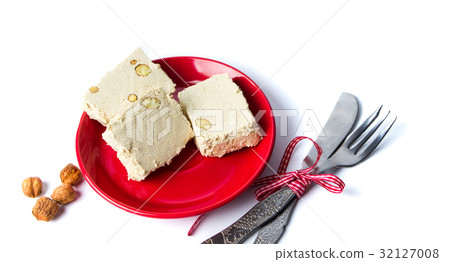 Hazelnut halva slices on a plate Hazelnut halva slices on a plate 32127008