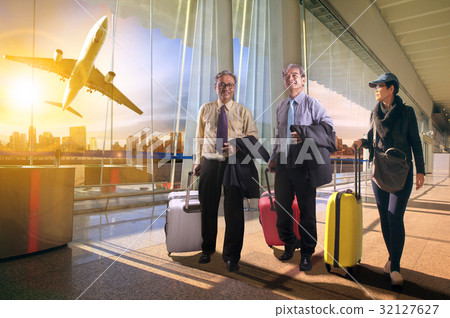 two business man and woman in airport terminal two business man and woman in airport terminal 32127627