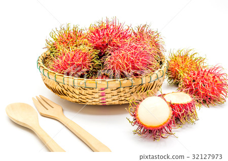 fresh tropical rambutan fruits over basket  32127973