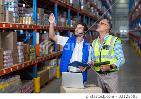Warehouse workers interacting with each other 32128583