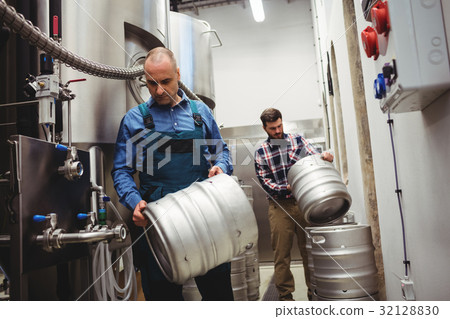 Owner and worker carrying kegs Owner and worker carrying kegs 32128830