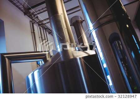 Industrial machinery at brewery 32128947