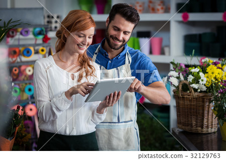 Couple using digital tablet Couple using digital tablet 32129763