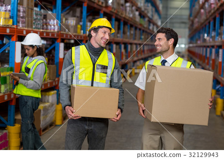 Warehouse worker interacting with each other 32129943