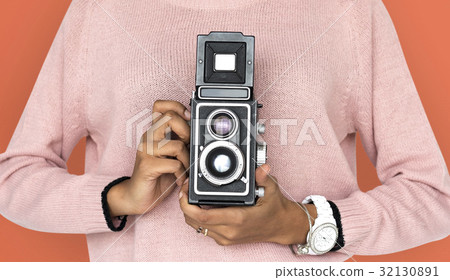 Girl Holding retro classic camera Girl Holding retro classic camera 32130891