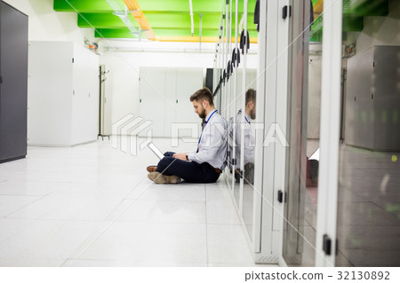 Technician using laptop Technician using laptop 32130892