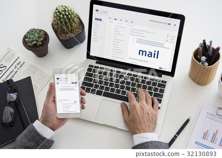 Hands composing an email on a digital device Hands composing an email on a digital device 32130893