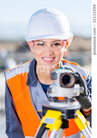 Surveyor with theodolite level 32131099