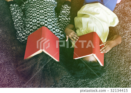 African sisters take a rest from reading books African sisters take a rest from reading books 32134415