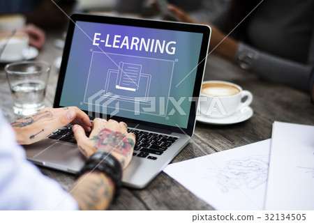 Woman with tattoos working using laptop Woman with tattoos working using laptop 32134505