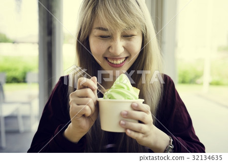 Woman eating melon ice-cream happiness Woman eating melon ice-cream happiness 32134635
