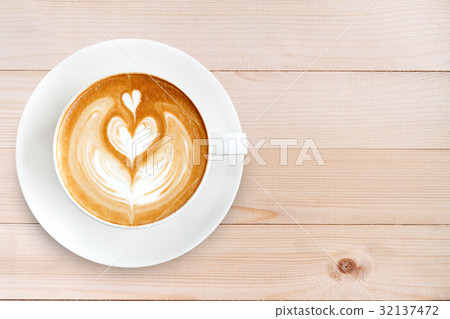 Top view latte art coffee on wood background 32137472