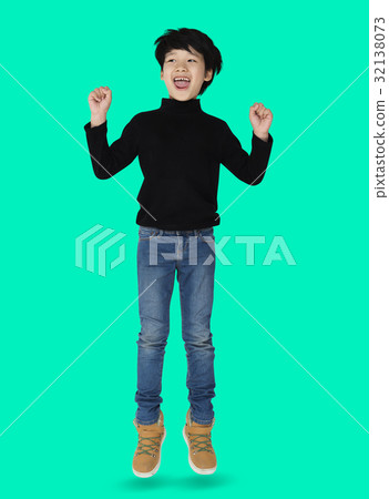 A happiness boy is jumping A happiness boy is jumping 32138073
