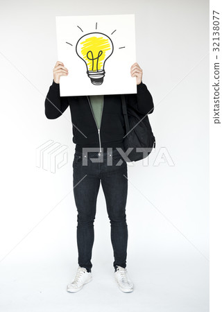 Man holding light bulb banner cover face studio portrait 32138077