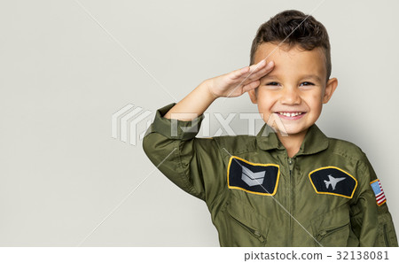 Little boy with pilot dream job salute and smiling Little boy with pilot dream job salute and smiling 32138081