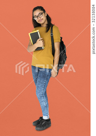 Indian girl student smiling and holding textbook 32138084