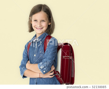 A little school girl is smiling A little school girl is smiling 32138085