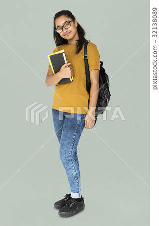Indian girl student smiling and holding textbook Indian girl student smiling and holding textbook 32138089