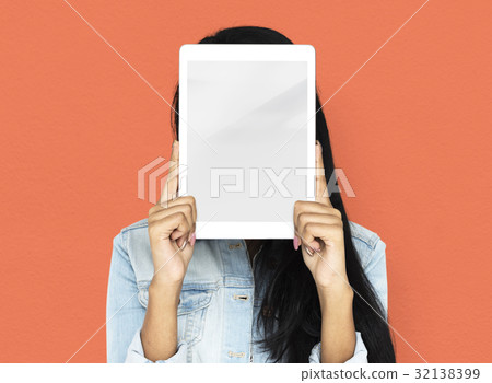 Woman using digital tablet covering her face 32138399