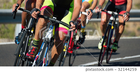 Cycling competition,cyclist athletes riding a race 32144259