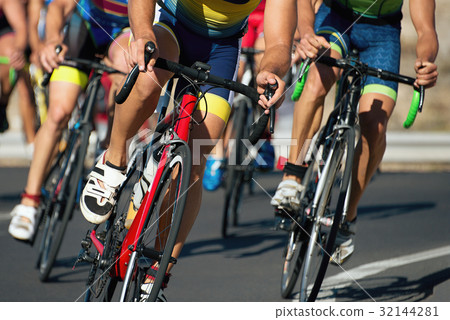 Cycling competition,cyclist athletes riding a race 32144281