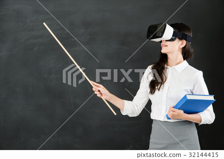 woman teacher teach with stick and VR headset 32144415