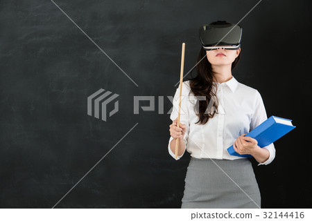 woman teacher teach with stick and VR headset 32144416