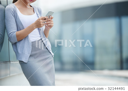 Checking smartphone Checking smartphone 32144491