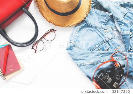 Flat lay of woman traveler items and passport  32147290