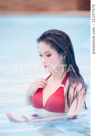 asia sexy woman standing in water at swimming pool asia sexy woman standing in water at swimming pool 32147478