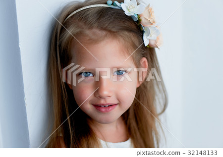 Charming girl with long ash-blond hair , lively 32148133