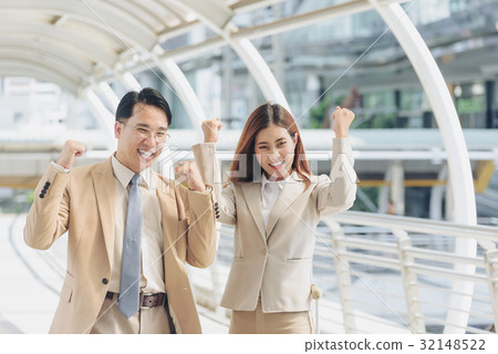 Happy business team celebrating victory  32148522