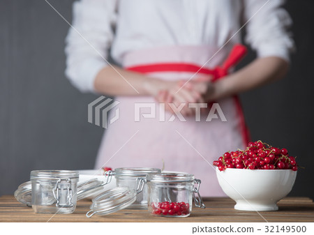 Housewife prepare canned head with ribes jam 32149500