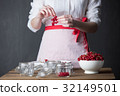 Housewife prepare canned head with ribes jam 32149501