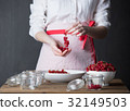 Housewife prepare canned head with ribes jam 32149503