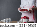 Housewife prepare canned head with ribes jam 32149505