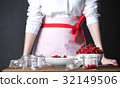 Housewife prepare canned head with ribes jam 32149506