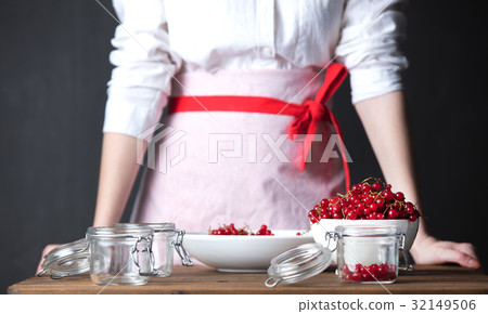 Housewife prepare canned head with ribes jam Housewife prepare canned head with ribes jam 32149506