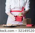 Housewife prepare gingerbread cookies as gift 32149520