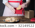 Housewife prepare gingerbread cookies as gift 32149522