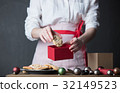 Housewife prepare gingerbread cookies as gift 32149523