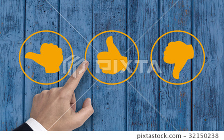 Hand pointing at rating icons with thumb Hand pointing at rating icons with thumb 32150238