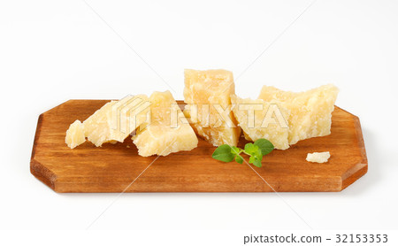 Parmesan cheese on cutting board 32153353