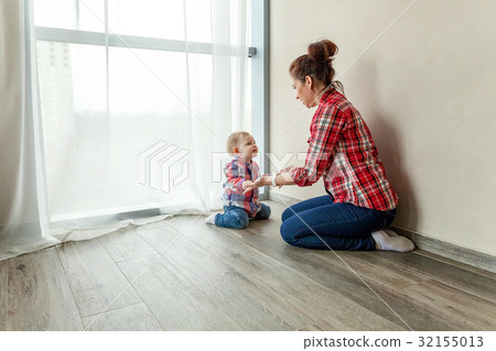 Young mother playing with her child Young mother playing with her child 32155013