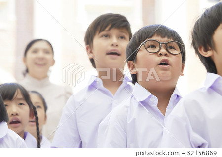 a group of students is singing national anthem solemnly a group of students is singing national anthem solemnly 32156869