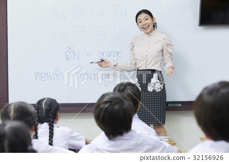 thai teacher is teaching English to the students 32156926